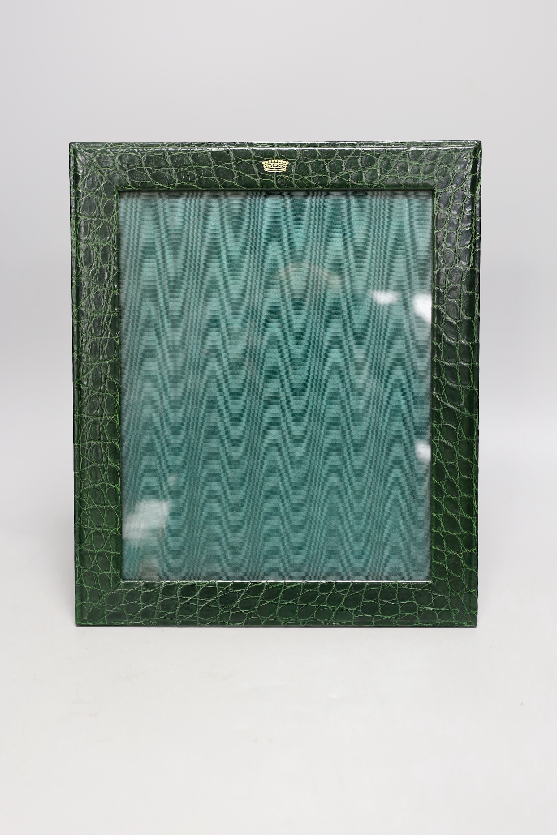 An Asprey green faux crocodile hide desk set, comprising photograph frame, 32 cm high and Moser glass ashtray